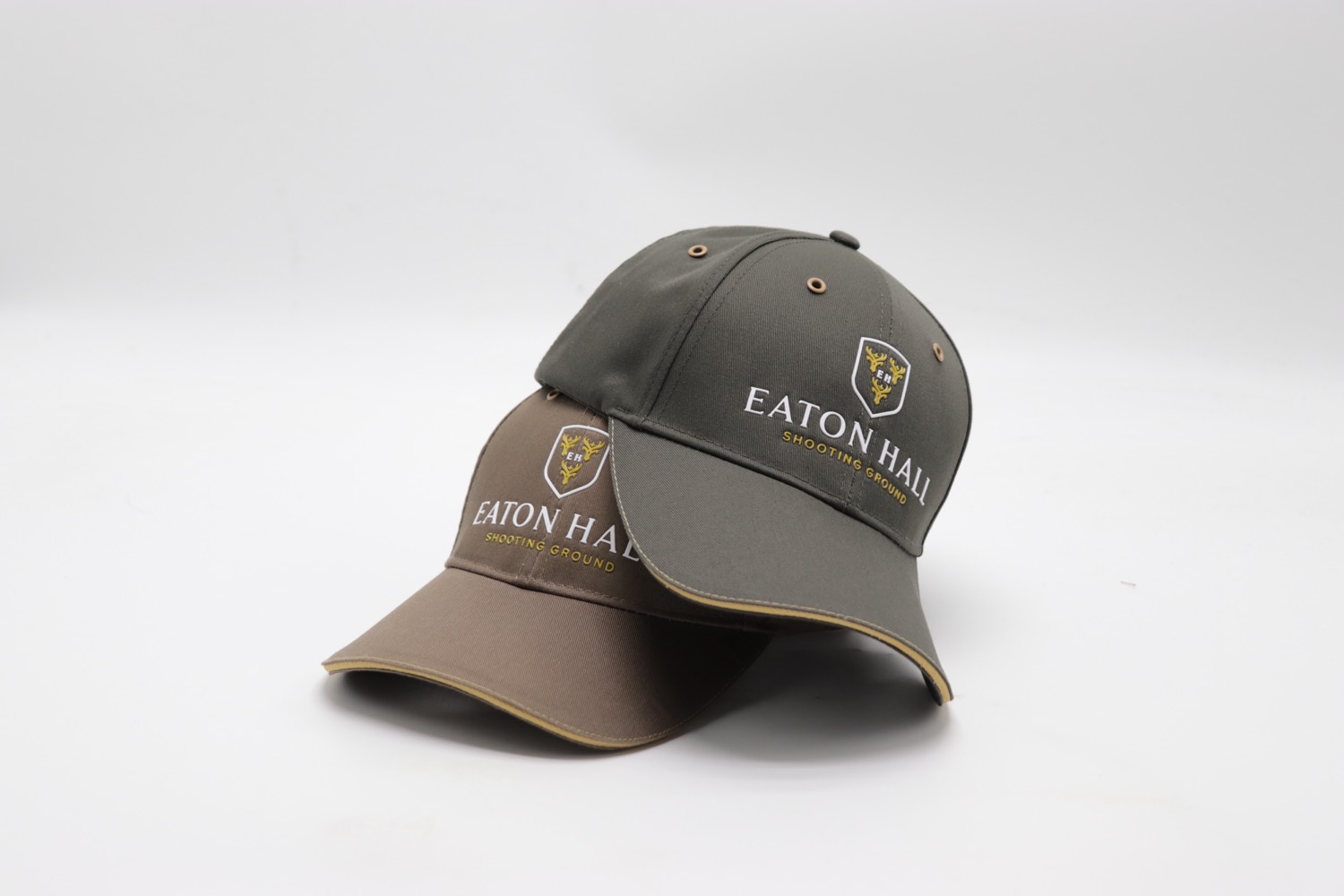 Eaton Hall shooting caps in olive and stone with gold crest