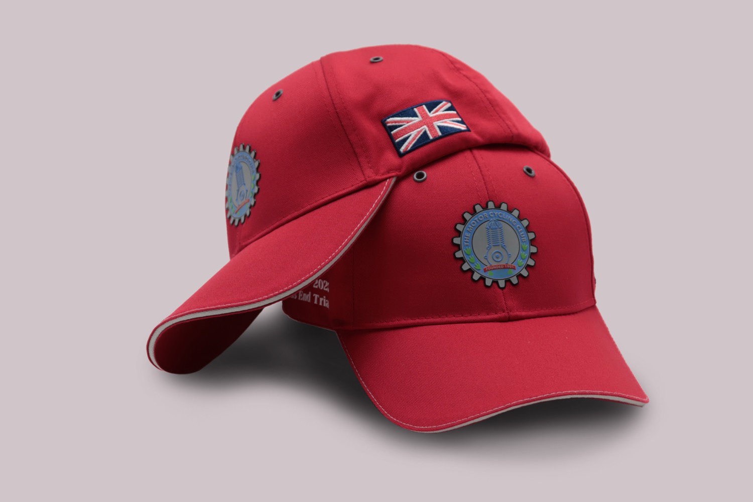 Red club caps with roundel badge and Union flag side panel